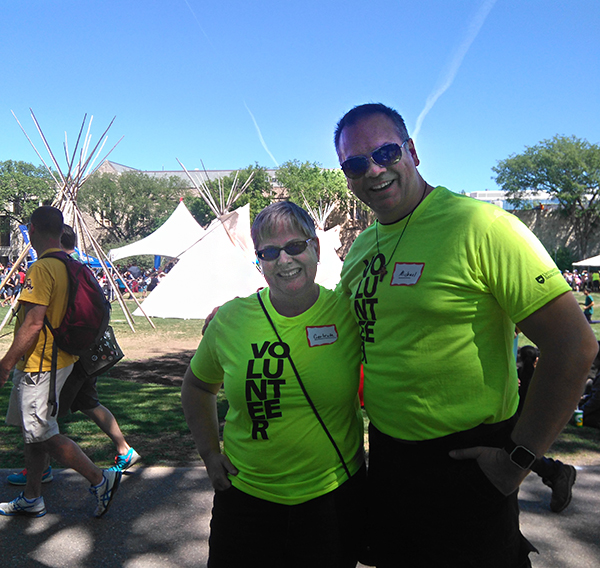 Gertrude Rompre and Michael MacLean volunteer at the May 2017 graduation powwow